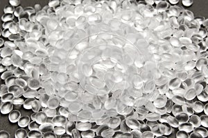 Transparent Polyethylene granules on dark .HDPE Plastic pellets.  Plastic Raw material . IDPE photo