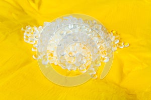 Transparent Polyethylene granules on plastic polyethylene film . HDPE.Plastic pellets. Plastic Raw material photo