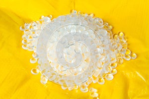 Transparent Polyethylene granules on plastic polyethylene film . HDPE.Plastic pellets. Plastic Raw material