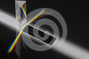 Transparent prism dispersing sunlight splitting into a spectrum on a white background