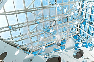 Transparent roof, round decorations, blue sky above