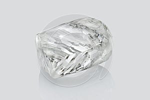 Transparent rough diamond isolated on white background photo