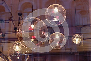 Transparent round lampshades with incandescent bulbs. design illumination