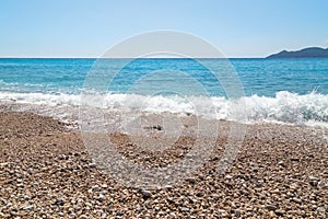 The transparent sea water and colorful sea stones in Kidrak Beach of Fethiye.