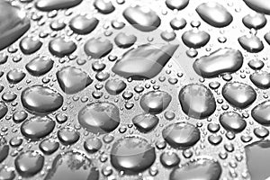 Transparent still water drops on light background. Water drops. Drops of rain on glass. Abstract water drop background. Water surf