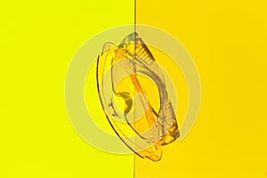 Transparent tinted glasses on yellow background. Creative monochrome layout