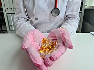Transparent vitamins in hands of doctor. Vitamin omega-3