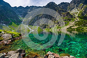 transparent water of a clean mountain lake Czarny Staw