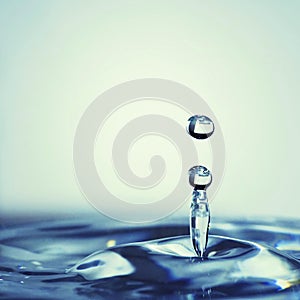 transparent water drop splash realistic and blue water colored on white