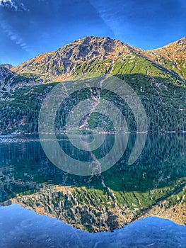 Transparent Water Reflecting Sunshine in Tatra Mountains