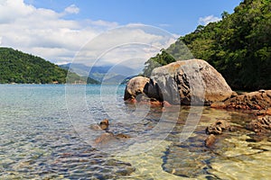 Transparent water and stones in sea near beach Cotia on island n