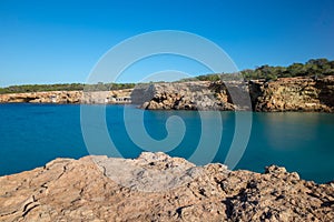 Transparent waters in the cala compte, Ibiza photo