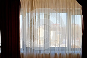 Transparent white curtain on window. Curtain background