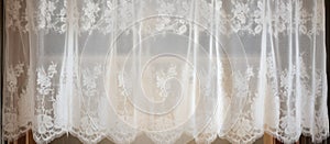 A transparent white lace curtain hangs on a freezing glass window