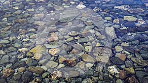 Transpartent water and rocky ground, ushuaia, argentina