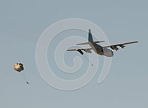 Transport airplane dropping soldiers