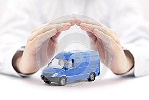 Transport blue van car protected by hands