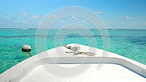 Transport Boat Anchored next to Coral Reef