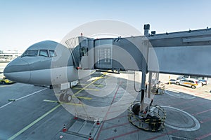 Transport and logistic concept by plane. Airplane with airport bridge, Jet bridge where passengers connect with the plane. airport