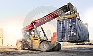 Transport, logistics and supply chain with container storage and a crane vehicle on a commercial dock. Shipping, cargo