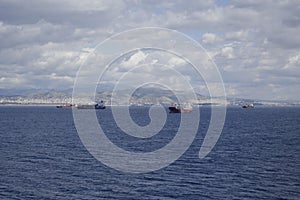 Transport ships move to the port along the coast.