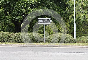 A transport signpost stating All Routes with the image of a lorry