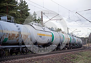 Transport tank car LNG by rail, gas - oil products. LPG transport propane. The fuel train, rolling stock with petrochemical tank