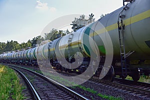 Transport tank car LNG by rail, gas - oil products. LPG transport propane. The fuel train, rolling stock with petrochemical tank