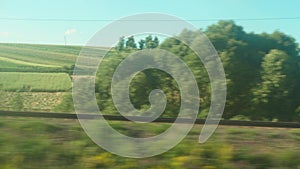Transport, travel, road, railway, landscape, comnication concept - view from the window of speed train on landscape of