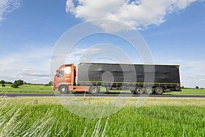 Transport truck driving on the road