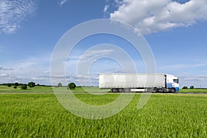 Transport truck driving on the road photo