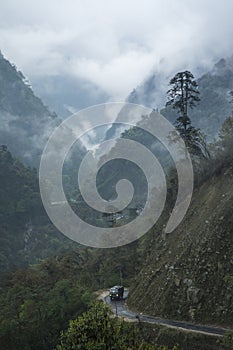 Transport vehical travelling on high mountain passes near Lachun,Sikkim,India