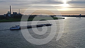 Transport vessel delivering gravel and coal on the river Rhine by Duesseldorf