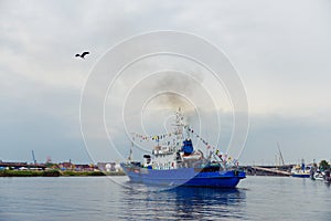 Transport vessels depart from the port to the open Baltic Sea