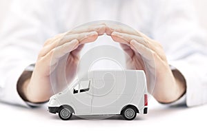 Transport white van car protected by hands