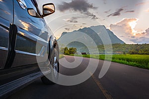 Transportation and car journey concept with SUV car on road and