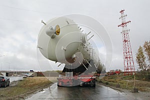 Transportation distillation column on the way to a petrochemical plant. Equipment for rectification