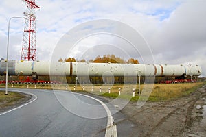 Transportation distillation column on the way to a petrochemical plant. Equipment for rectification