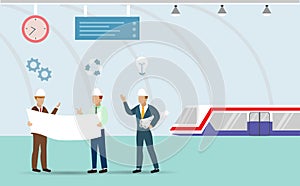 Transportation engineering team holding blueprints discussing project plan at subway metro underground railway station.