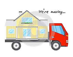Transportation and home removal. Comfortable house on a red truck. We`re moving.