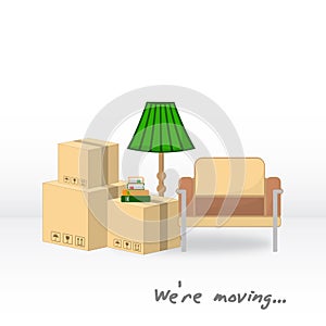 Transportation and home removal. We`re moving. Boxes, armchair, floor lamp, books in anticipation of moving.