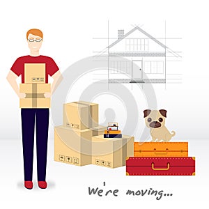 Transportation and home removal. We`re moving. A Little pug sitting on suitcases with things. A young man is holding boxes.