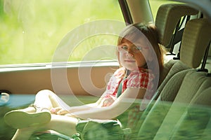 Transportation. Little girl child kid sitting in the car