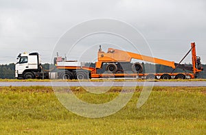 Transportation of oversized cargo by truck. Tower for carrying out repair work on a trailer