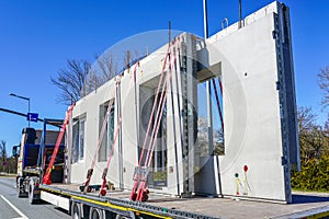 Transportation of reinforced concrete precast wall panels for house construction by truck