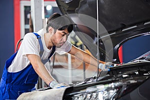 Transportation repair service concept, Repairman auto mechanic check for damage inside engine. man worker service engine mechanic