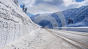 Transportation, traffic and magnificent views on mountainous roads in winter