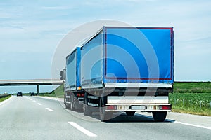 Transportation Truck on country highway under blue sky