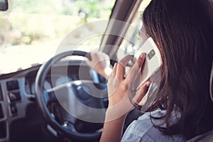 Transportation and vehicle concept - man using phone while driving the car