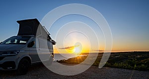 Transporter Camping Van bus at the California Ocean in the coastal Nature